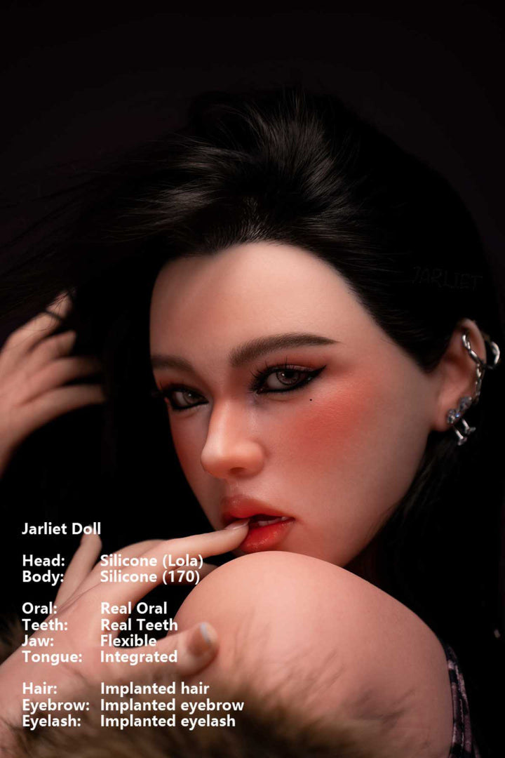 Jarliet Doll 170 cm G Silicone - Lola close-up face details, with silver earrings, biting finger, dark background.