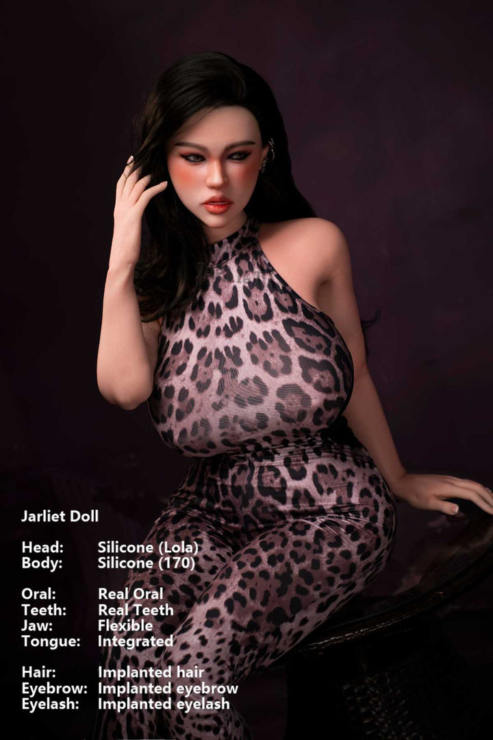 Jarliet Doll 170 cm G Silicone - Lola wearing a leopard print sexy jumpsuit, seated pose hand in hair, dark purple background.