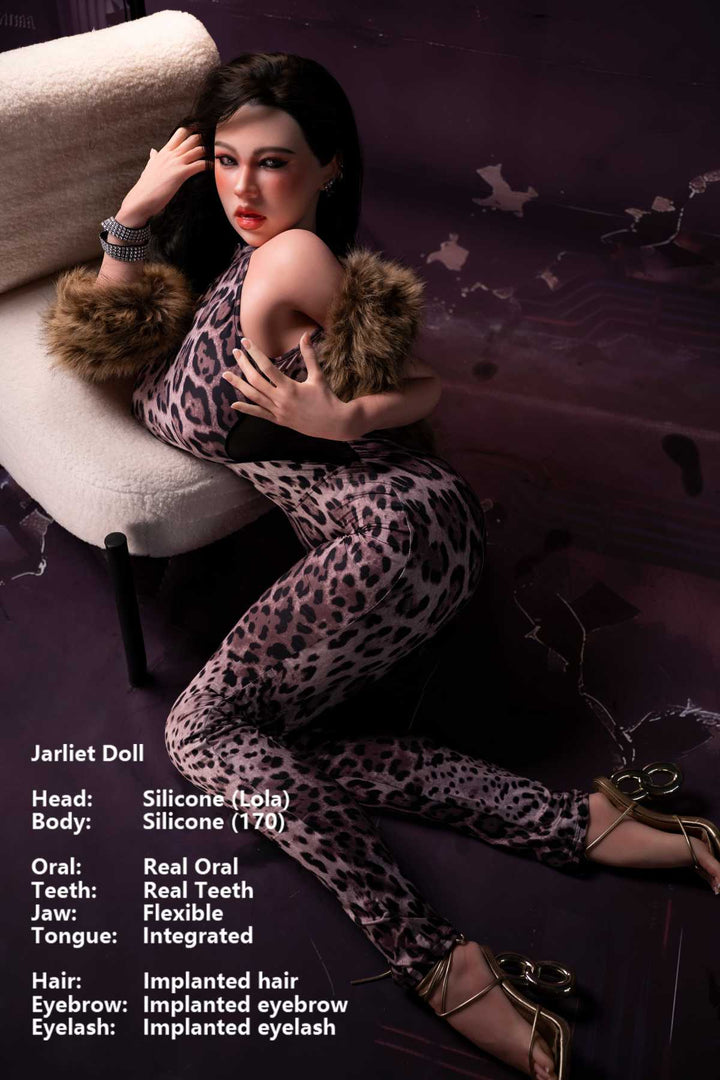 Jarliet Doll 170 cm G Silicone - Lola wearing a leopard print sexy jumpsuit with fur trim and gold heels, kneeling pose on floor, cracked purple background.