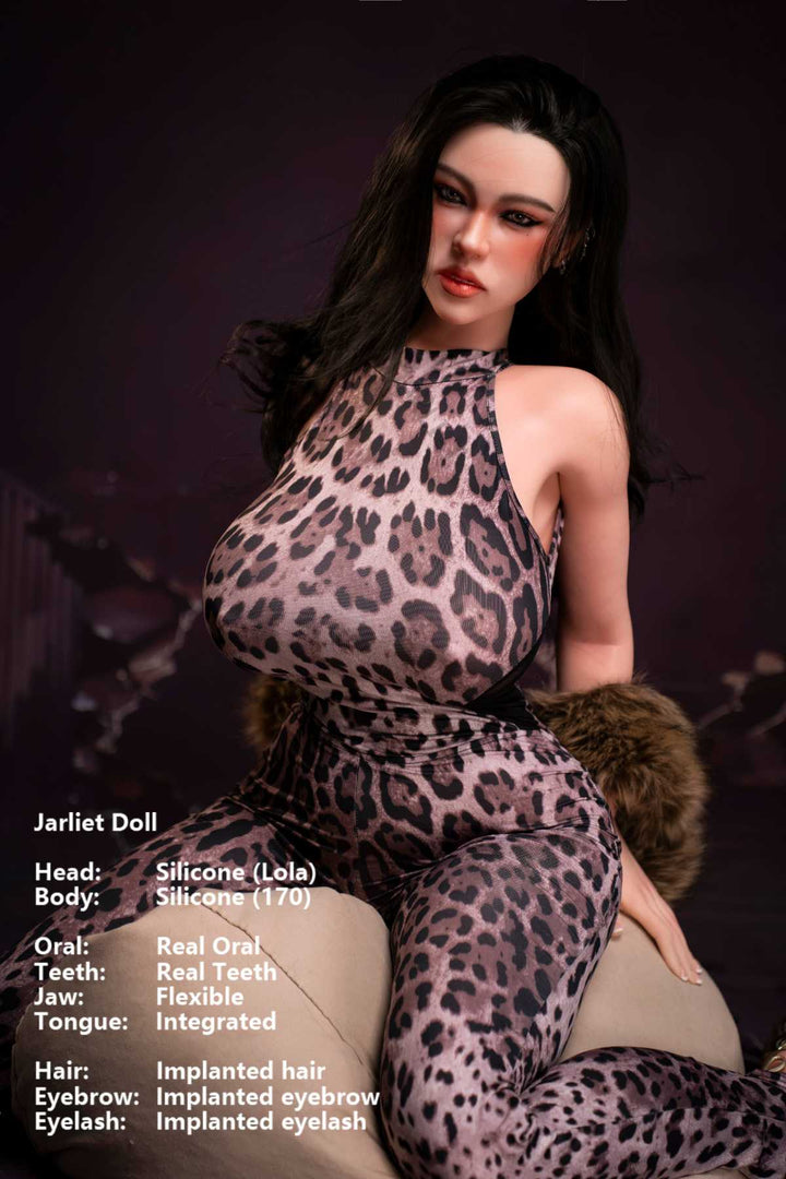 Jarliet Doll 170 cm G Silicone - Lola wearing a leopard print sexy jumpsuit with fur trim, seated close-up pose against a dark violet cracked background.