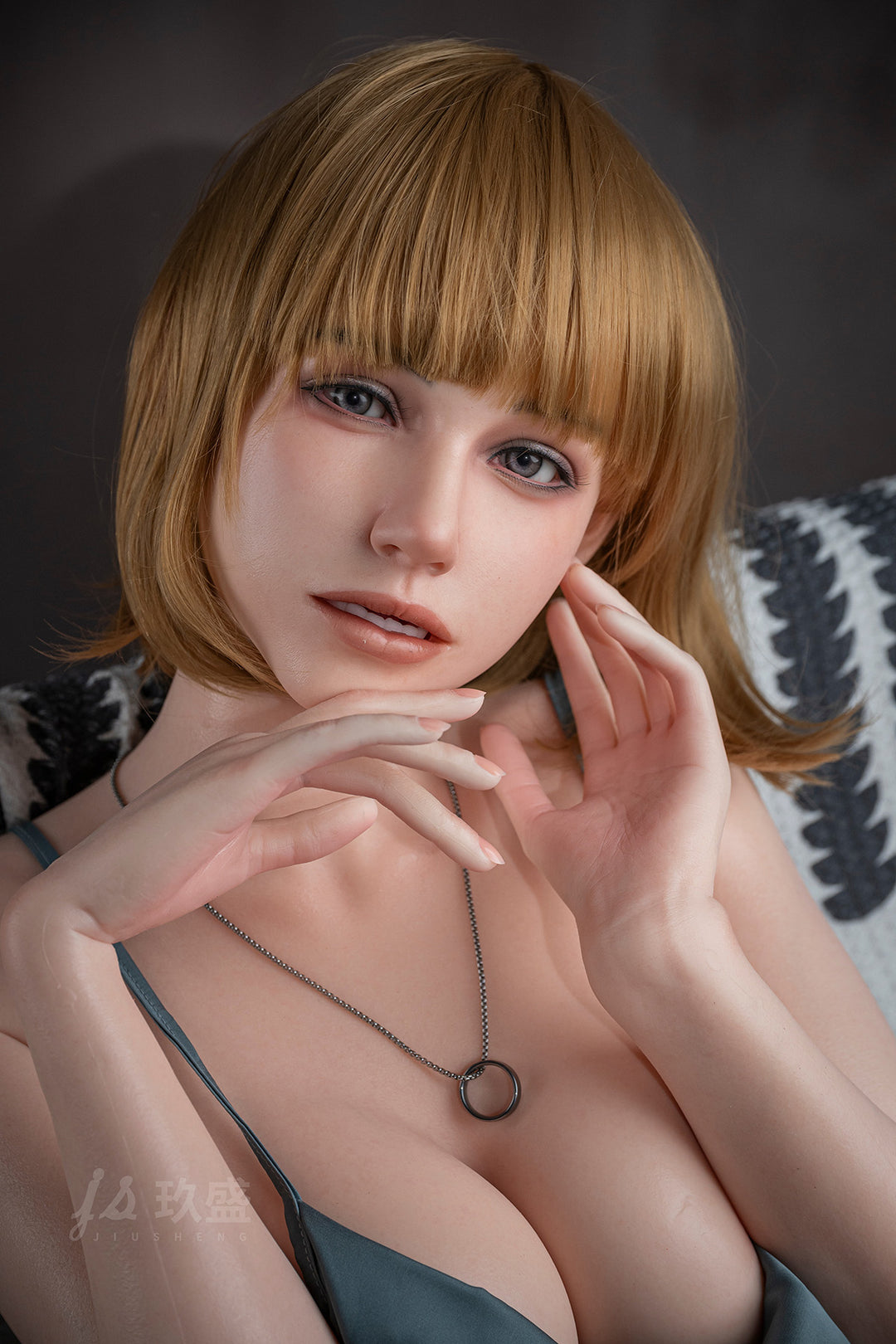Close-up of Jiusheng Doll 152 cm E Silicone – Yoyo, showing detailed face, short blonde hair, and necklace.