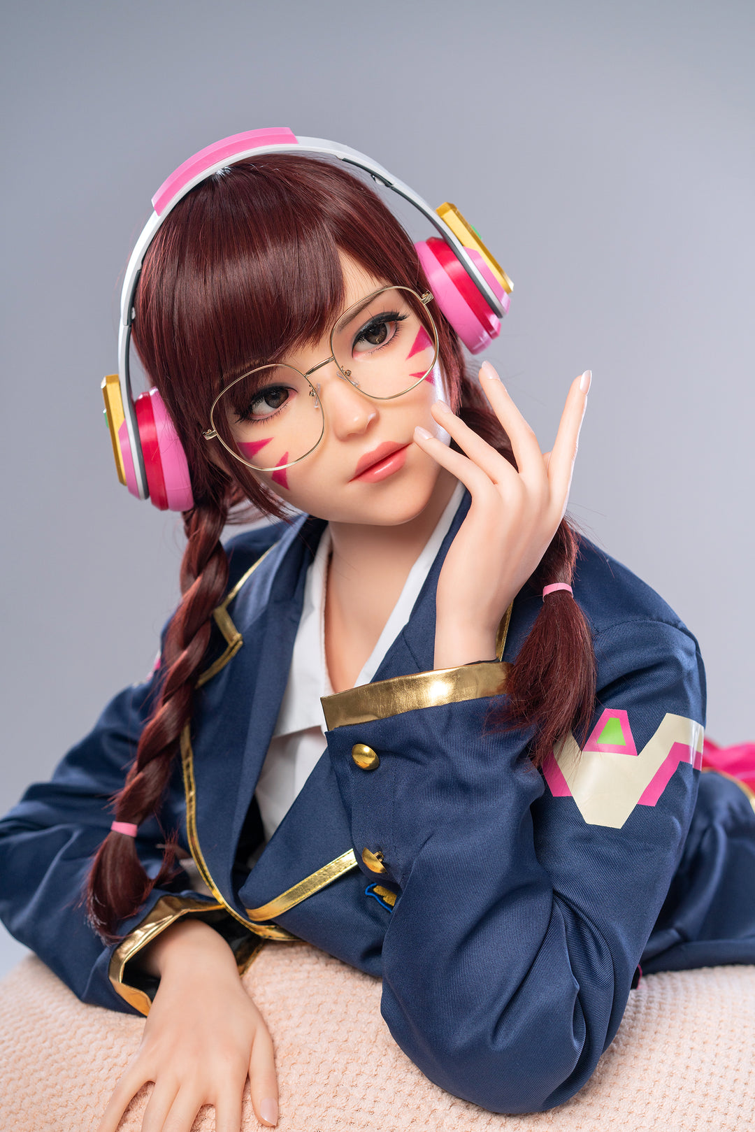 Game Lady 166 cm E Silicone – Dva dressed in a navy blue school uniform jacket with pink headphones and glasses, featuring detailed facial features and braided hair.