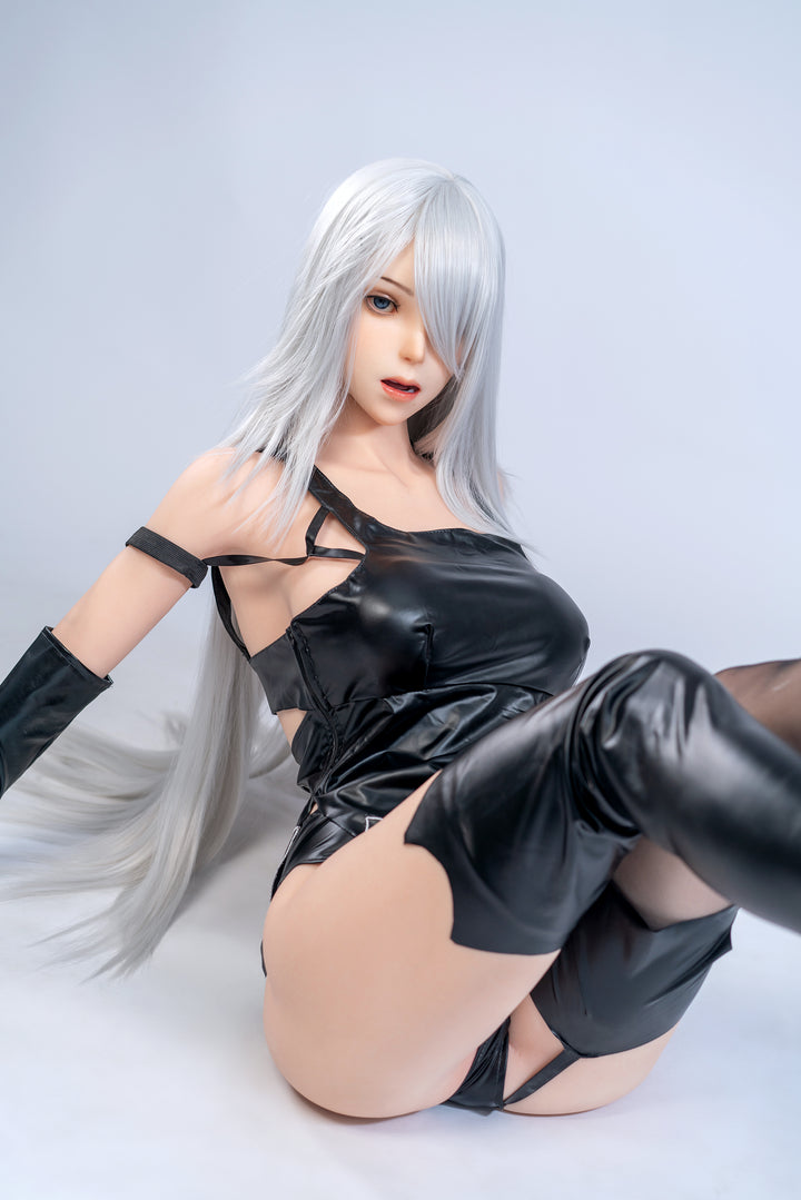 Full-body view of Game Lady YorHa A2 doll in black outfit, seated with arms posed gracefully.