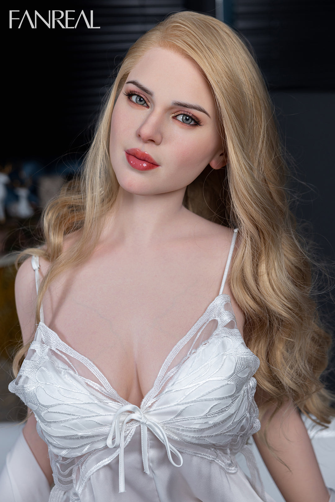 FANREAL Doll Gina – 155 cm F-Cup Silicone Doll with realistic skin texture, shown wearing a white lace nightgown, featuring soft facial details and blonde wavy hair.