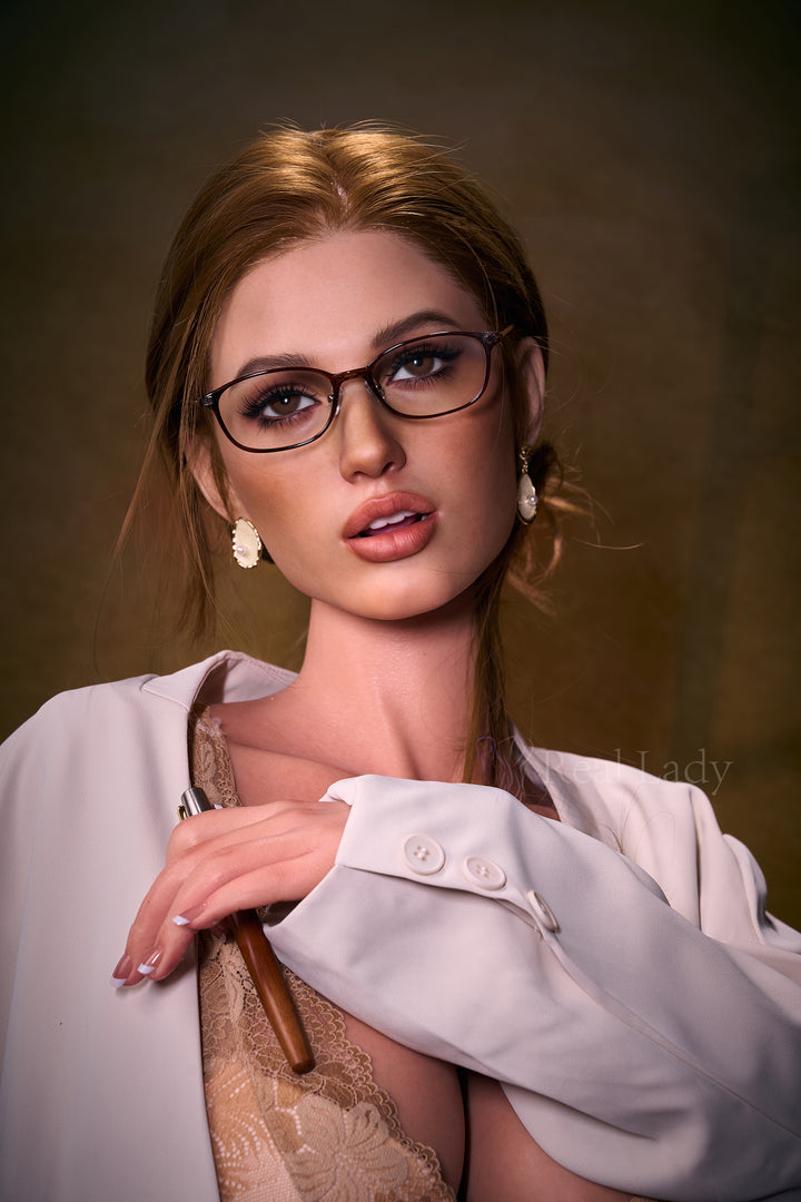 RealLady 168 cm G Silicone - Bianca wearing glasses and a white shirt with a brown background