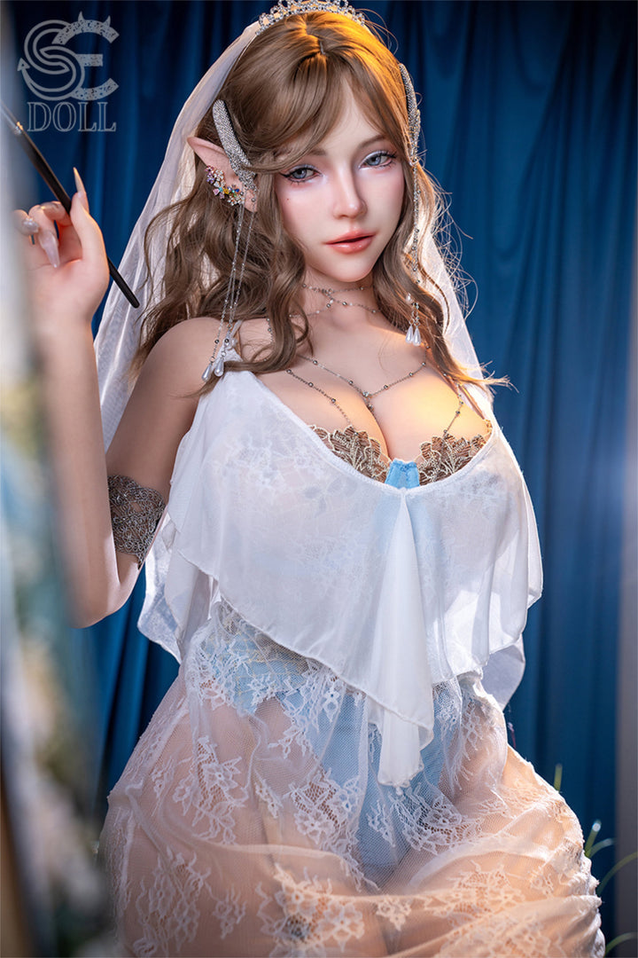 SEDOLL 157 cm I Silicone - Annika.L three-quarter view in blue lace lingerie with elf ear accessories, long auburn wavy hair, dark fantasy background
