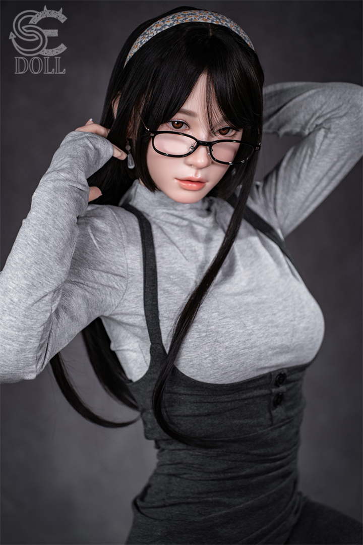 Realistic SEDOLL T153 cm A Aya Series Silicone -  Hinata.A with black hair and glasses wearing a gray top and black overalls.