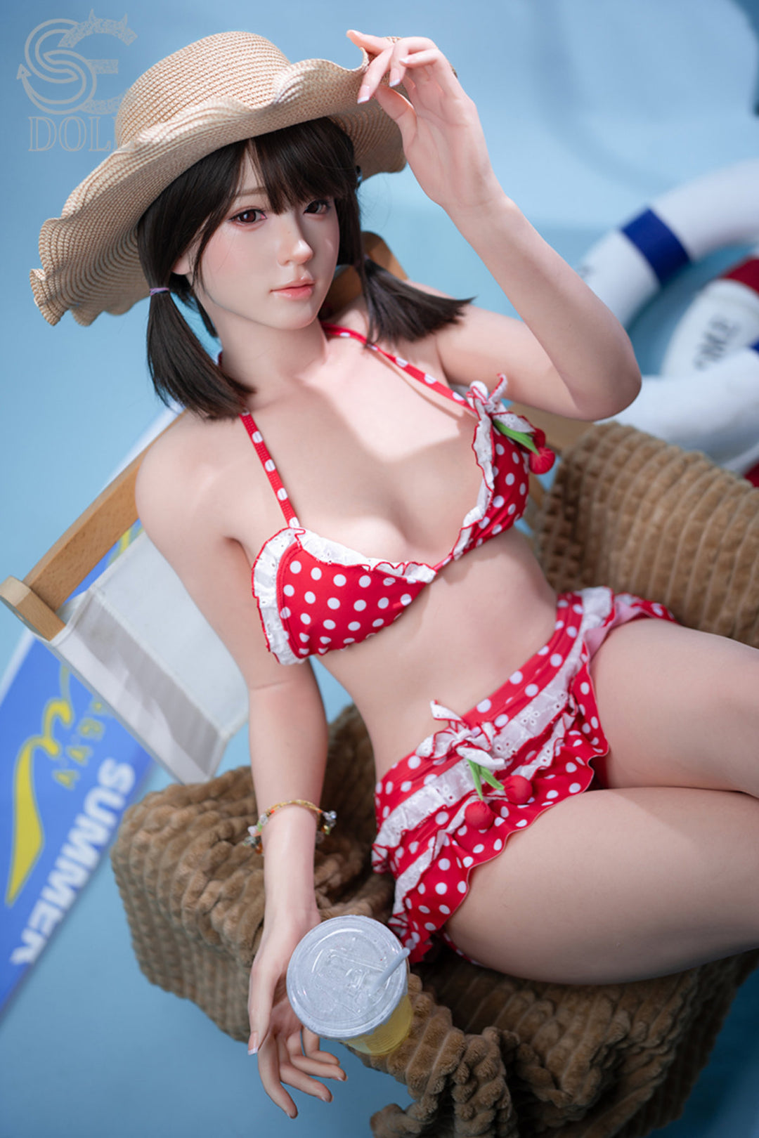 SEDOLL T159cm A Aya Series Silicone - Airi.A – Seated pose with straw hat, red polka-dot bikini set, dark bangs and long hair down, blue backdrop with beach props.