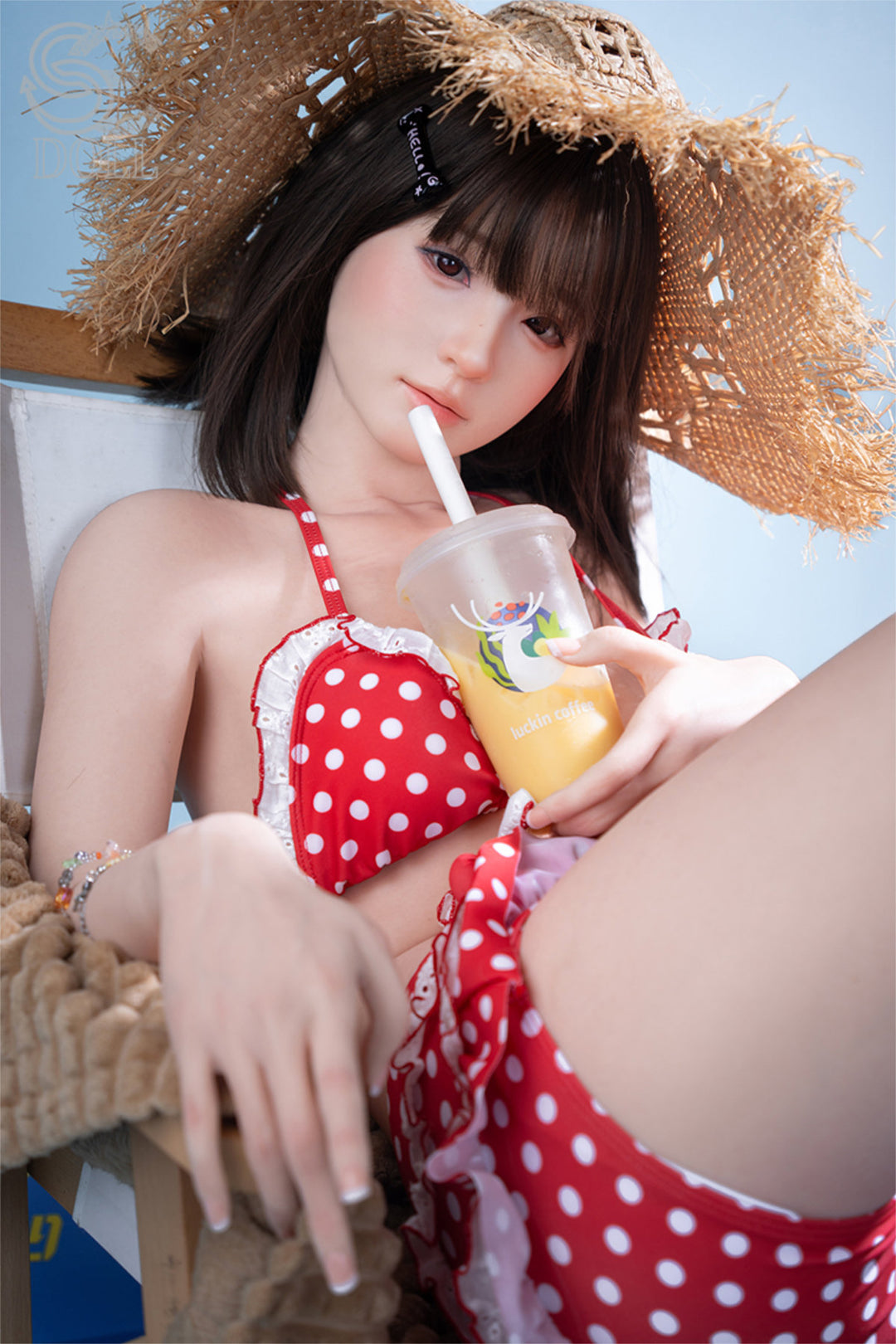 SEDOLL T159cm A Aya Series Silicone - Airi.A – Seated pose with legs extended, red polka-dot bikini bottom, bikini top pulled down, dark bangs and hair down, blue backdrop.