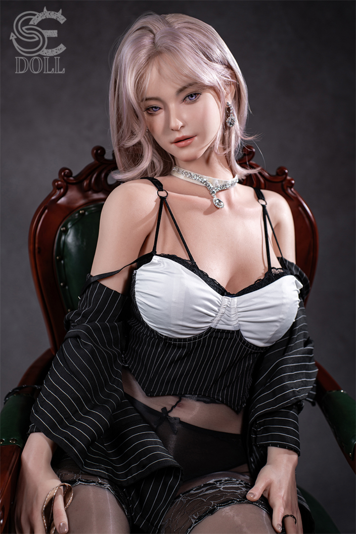 SEDOLL T160 cm C Aya Series Silicone -  Shion.B wearing a black and white outfit sitting on a wooden chair.