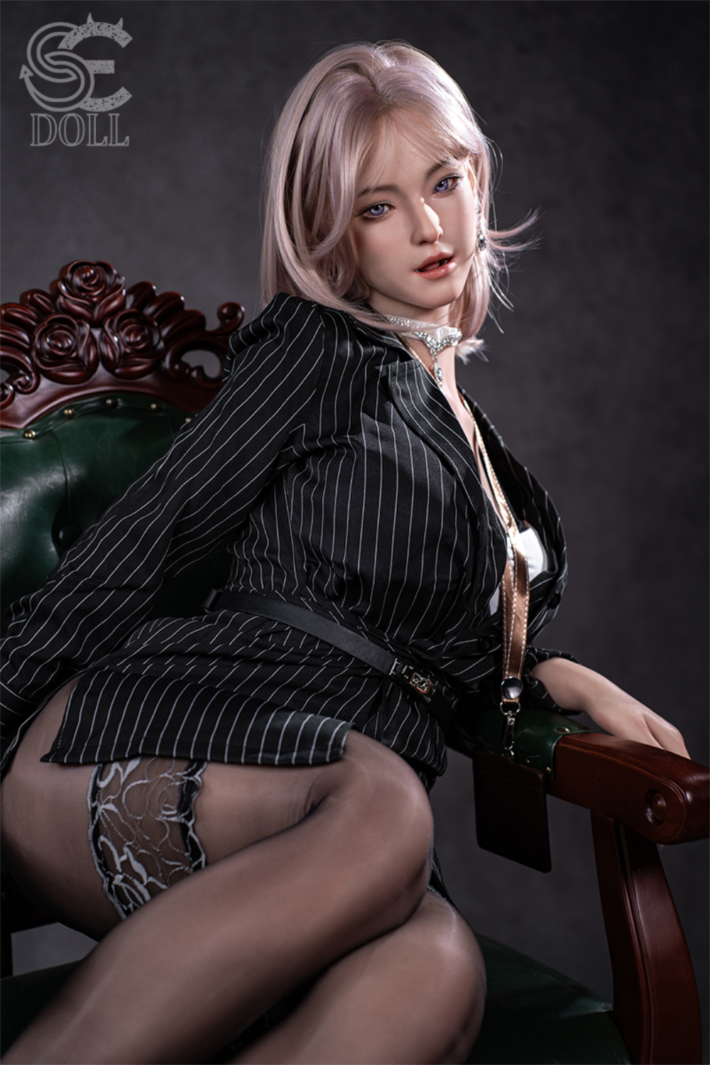 SEDOLL T160 cm C Aya Series Silicone -  Shion.B with blonde hair and a black pinstripe outfit sitting on a chair.