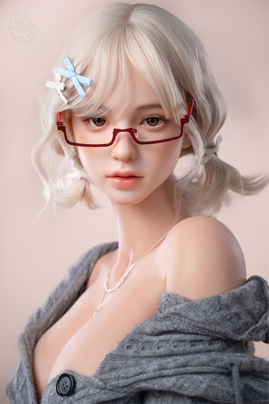 SEDOLL T161 cm C Aya Series Silicone - Miki.B close-up portrait, wavy platinum hair, blue flower hair clip, round red-frame glasses, off-shoulder gray knit cardigan, soft beige studio backdrop