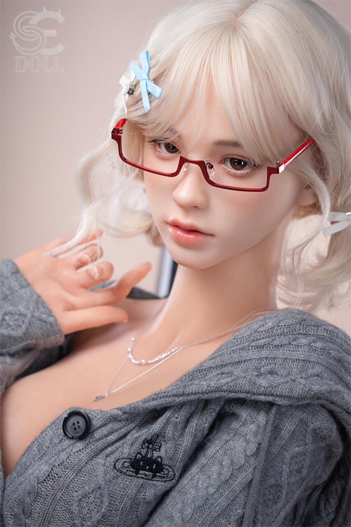 SEDOLL T161 cm C Aya Series Silicone - Miki.B close-up with hand near her chin, red glasses, off-shoulder gray sweater
