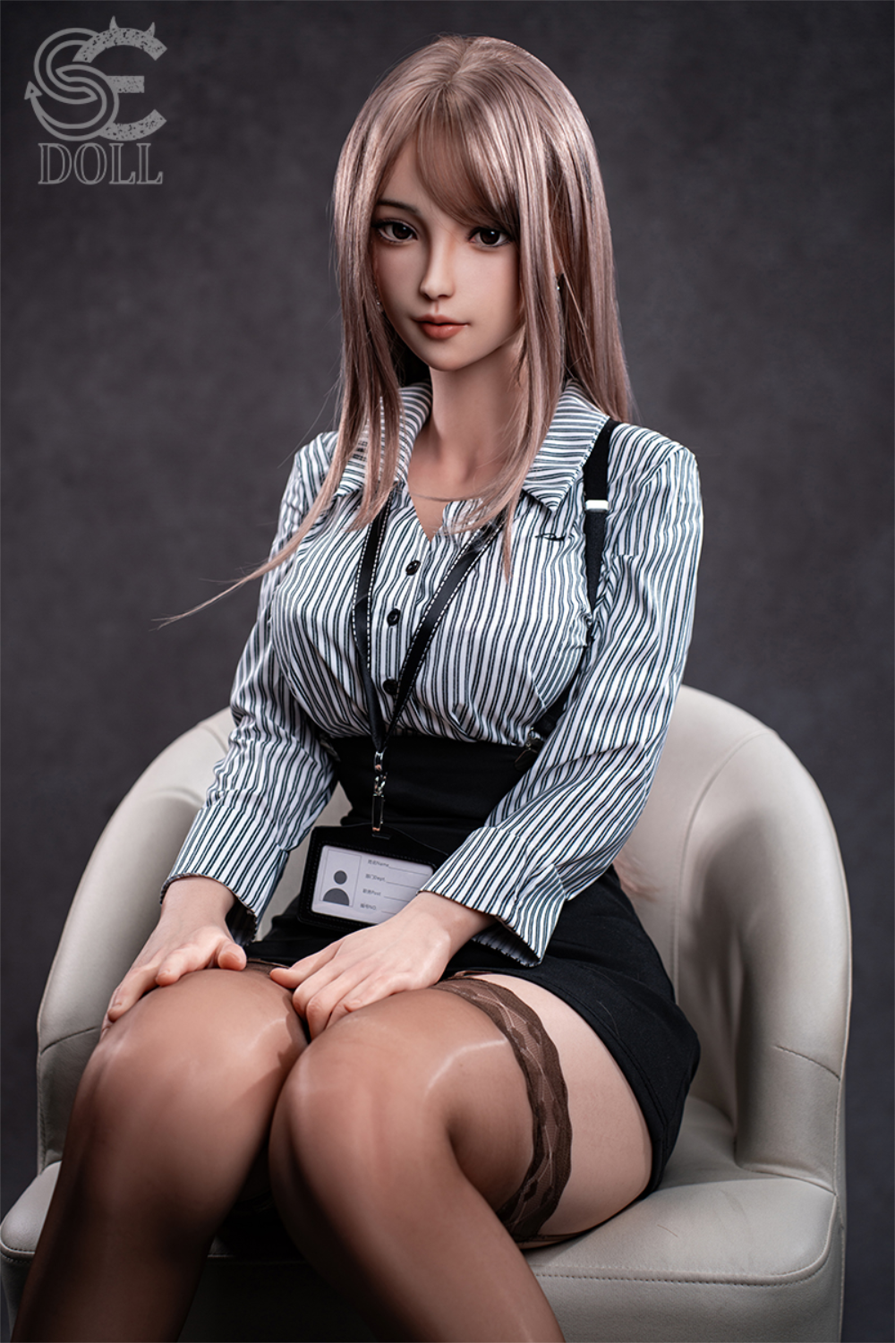 SEDOLL T161 cm C Aya Series Silicone -  Yuuki.K with pink hair and a striped shirt sitting on a chair.