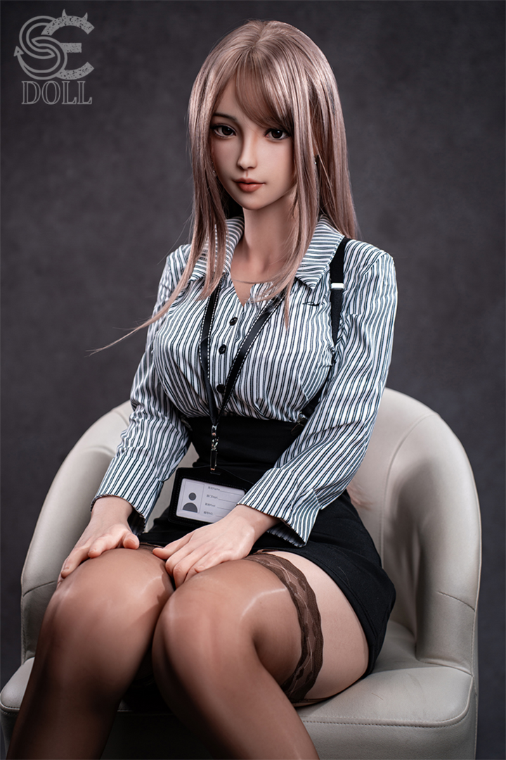 SEDOLL T161 cm C Aya Series Silicone -  Yuuki.K with pink hair and a striped shirt sitting on a chair.