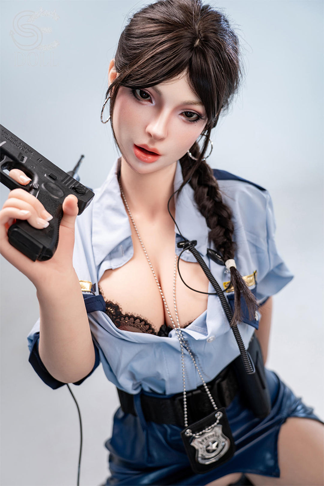 SEDOLL T161 cm C Silicone Pro - Nadia Voss.B close-up holding a prop handgun near her shoulder, unbuttoned blue denim shirt, tactical styling
