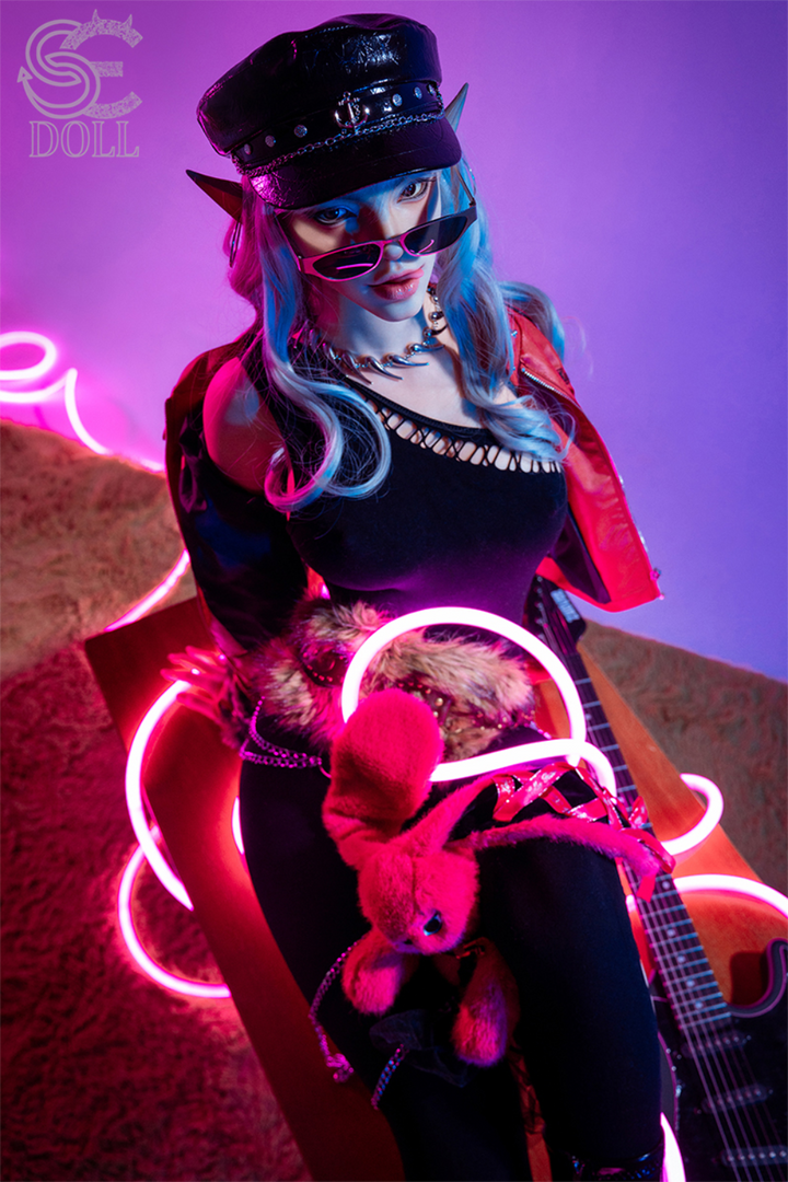 Full view of SEDOLL T165 cm C Silicone Pro - Evadora.B in a punk outfit with a red jacket, sitting amidst pink neon coils.