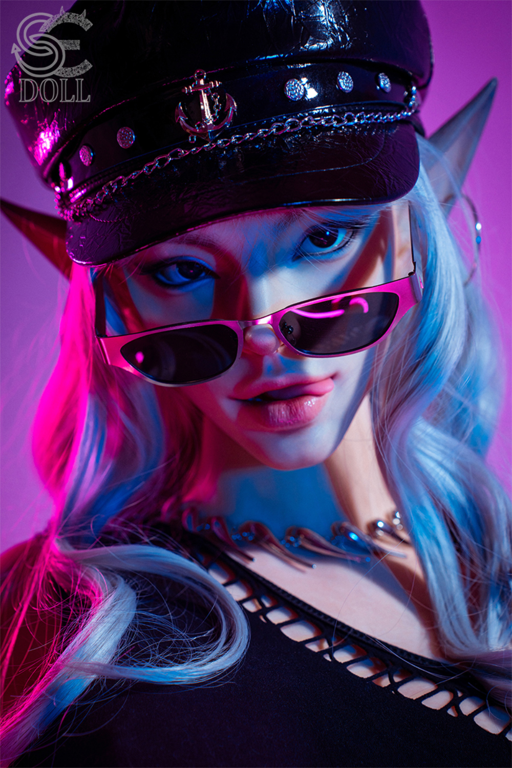 Close-up of SEDOLL T165 cm C Silicone Pro - Evadora.B with elf ears, blue hair, and a black captain’s hat under neon lights.