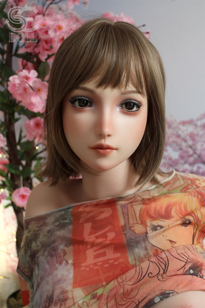 A front-facing close-up of the SEDOLL T160 cm B Silicone Pro - Yuuki.B featuring a detailed facial sculpt, short bangs, and a sheer off-the-shoulder anime-style shirt.