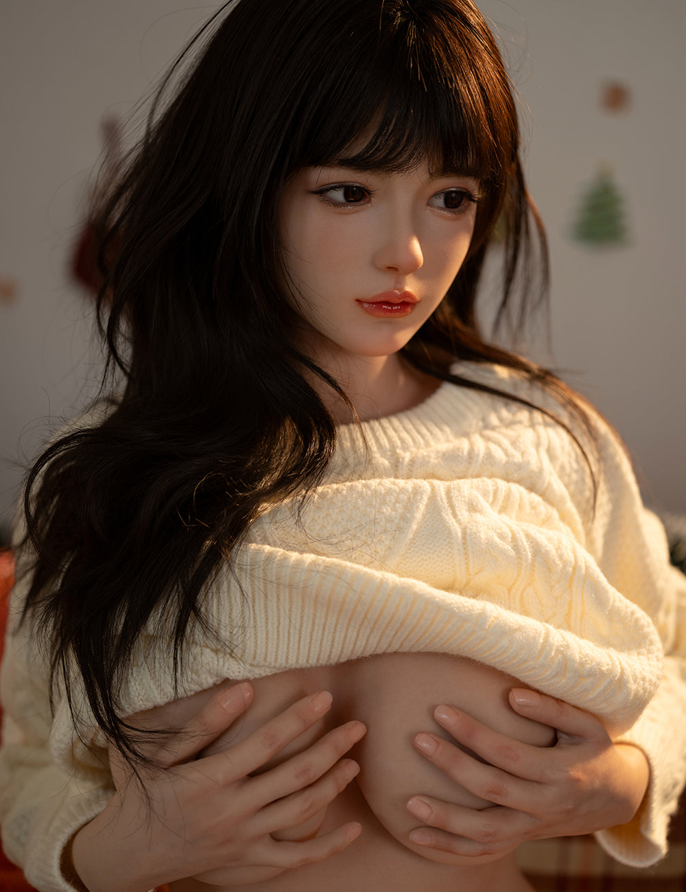 Close-up of the TOP-CYDOLL 162 cm E-Cup Sato Asuka lifting her white sweater to showcase her chest, highlighted by warm, natural lighting.