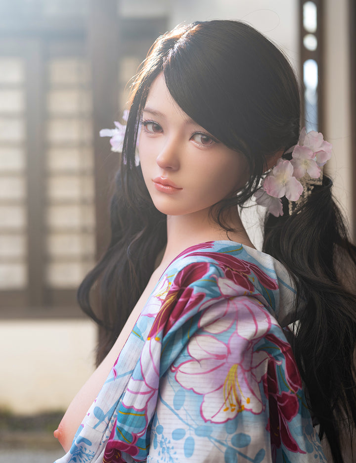 Profile view of the TOP-CYDOLL 162 cm E-Cup Sato Asuka V2 realistic sex doll wearing a floral yukata in soft, natural lighting.