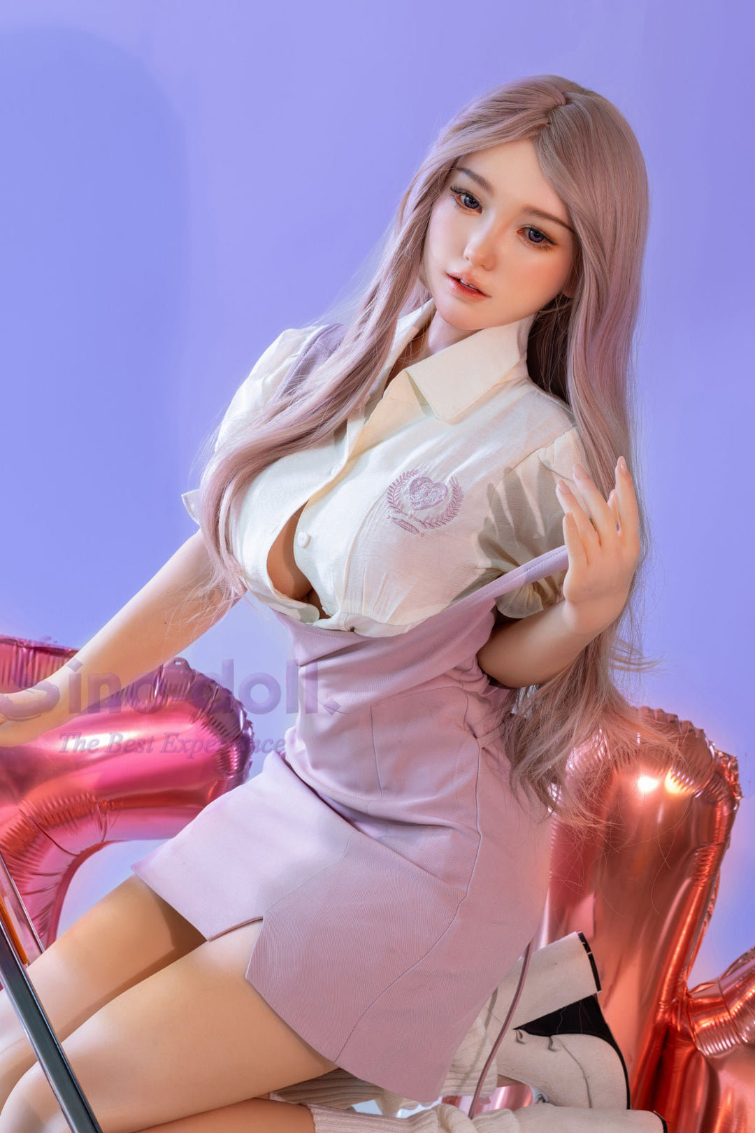 Sino Doll Pro Soft Max 161 cm Platinum Silicone - Linchun (R+S Effect) wearing a white blouse and pink skirt with long hair, sitting on a pink chair.