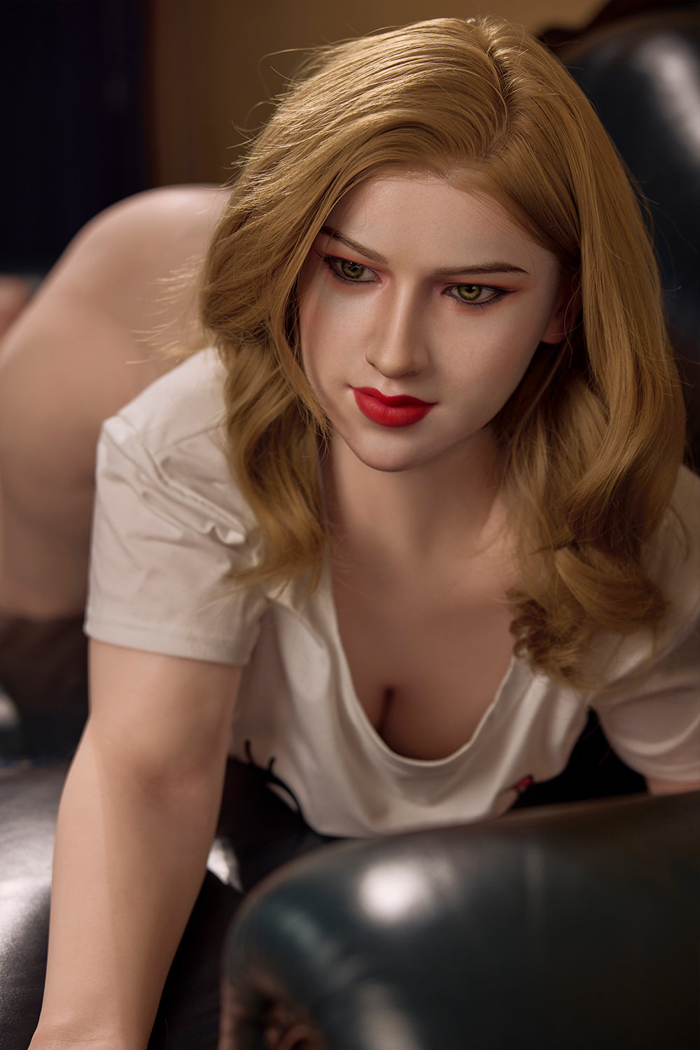 Starpery 161 cm H - Ashley ROS Head leaning forward pose in white top, red lipstick on a black couch.