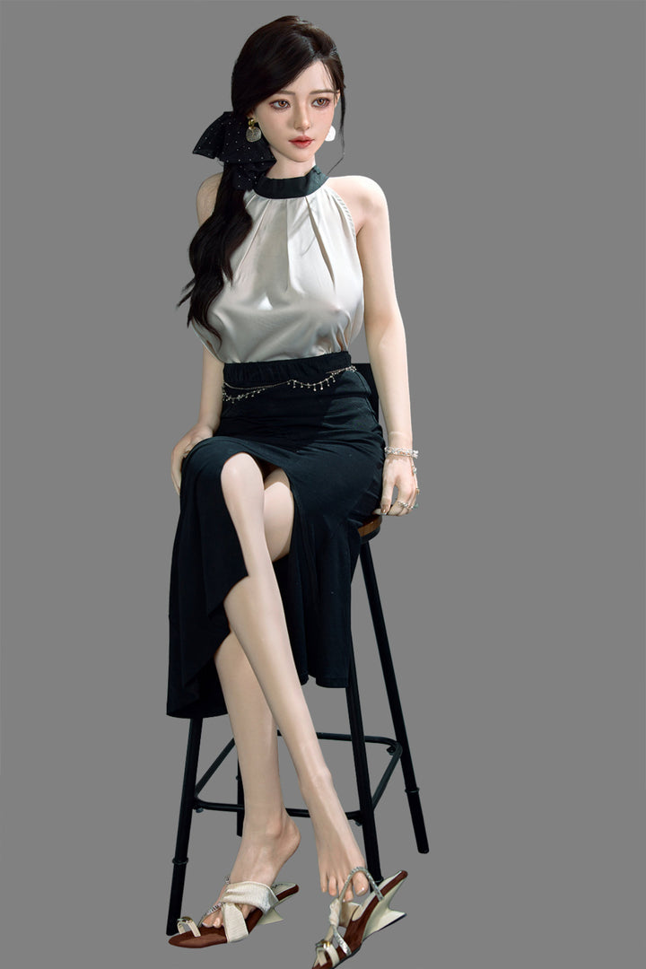 Starpery 171cm D - Asuka Eva – Standing pose, cream halter top with black skirt, dark hair in half-up style, plain grey backdrop.