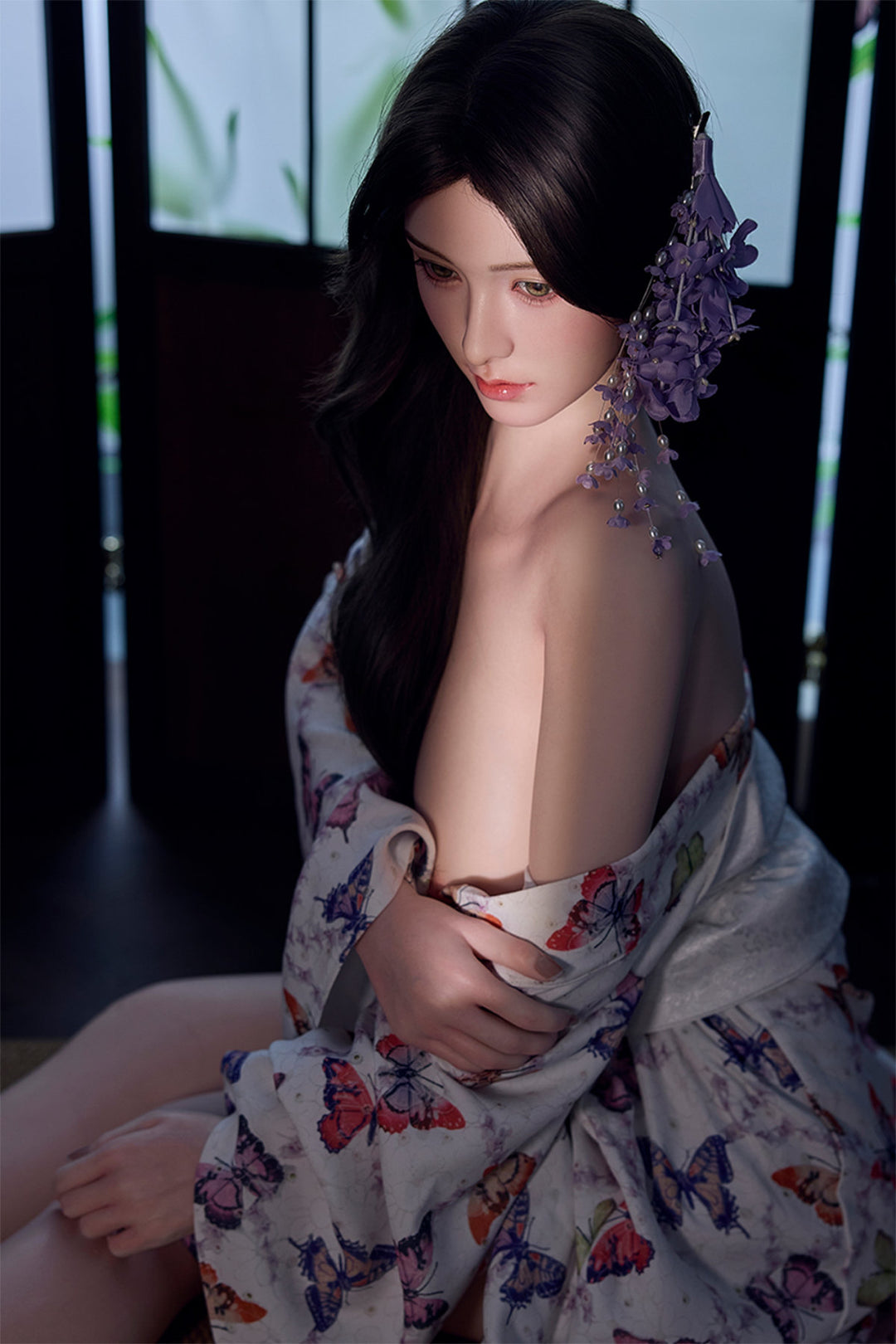 Starpery 171cm D - Xue V3 – Seated pose, floral kimono-style robe open at chest, dark wavy hair down, dark backdrop.