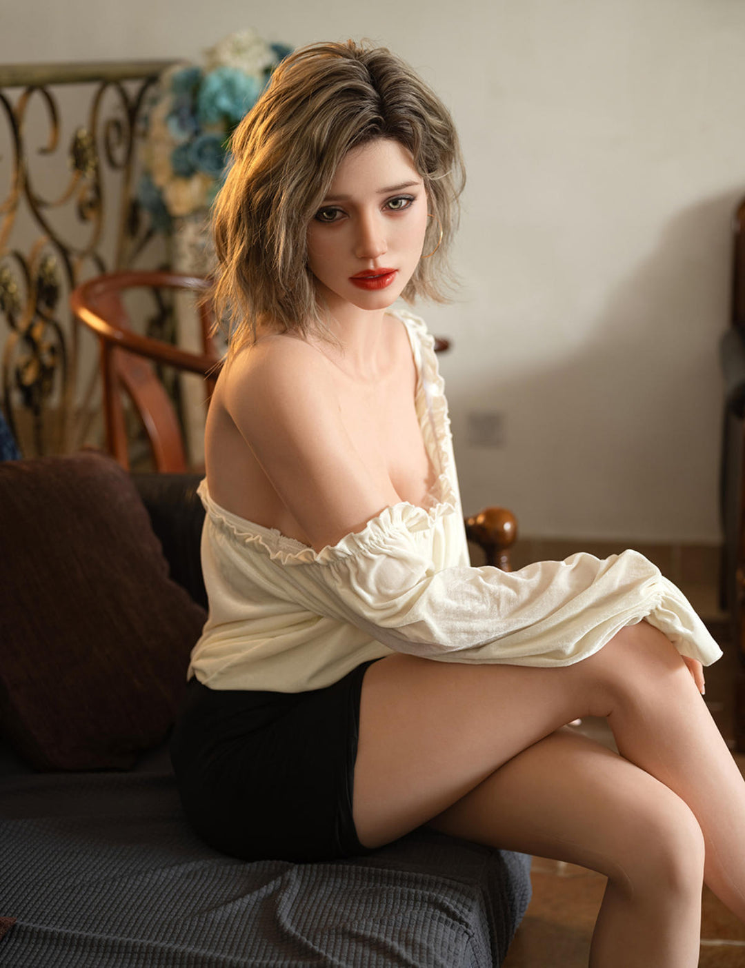 TOP-CYDOLL 168cm F-Cup Sofia Realistic Sex Doll in a white lace top and black shorts sitting on a couch.