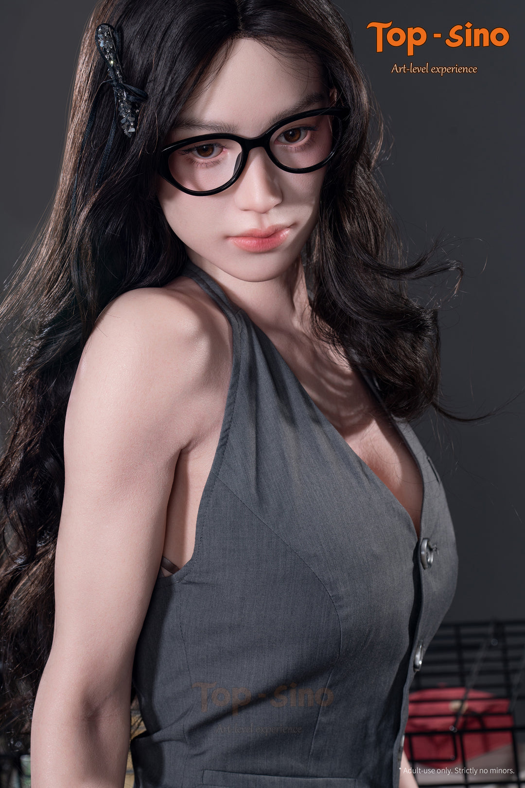 Top Sino T165 cm Platinum Silicone  Recreated Series - Miyun (RRS+) wearing glasses and a gray dress showing her bare shoulder.