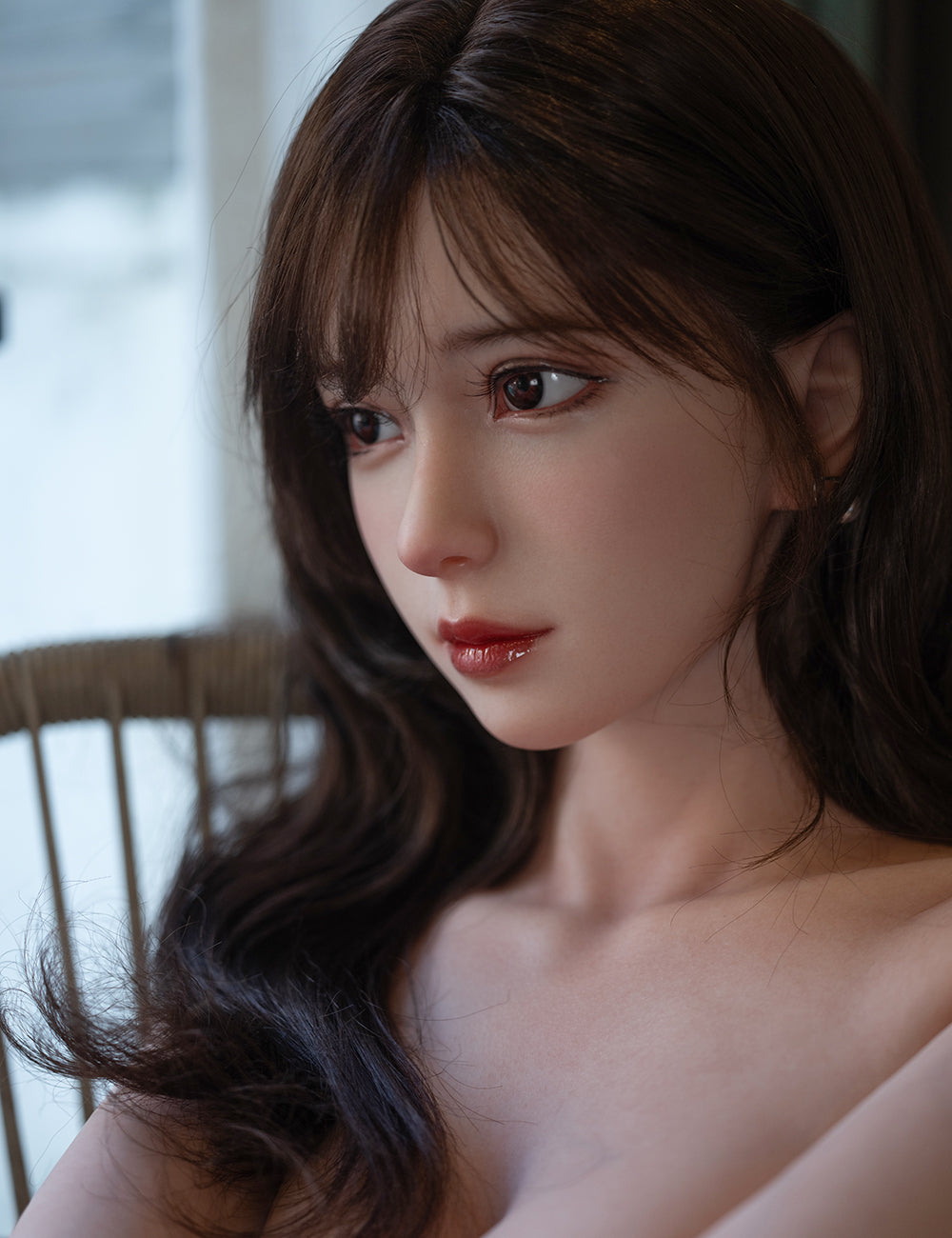 Close-up portrait of Una sex doll with soft lighting and realistic face