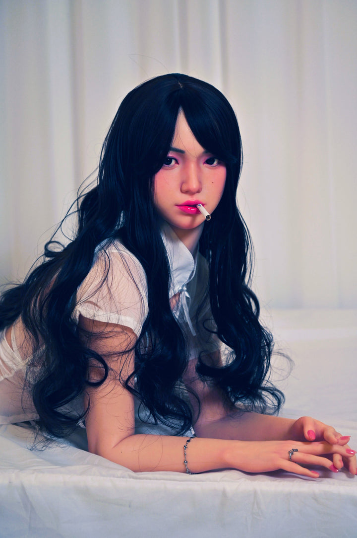 Zelex Doll K-Series 159 cm D Silicone - Suyeon close-up upper body shot in white lace lingerie, long black wavy hair, white bedding background
