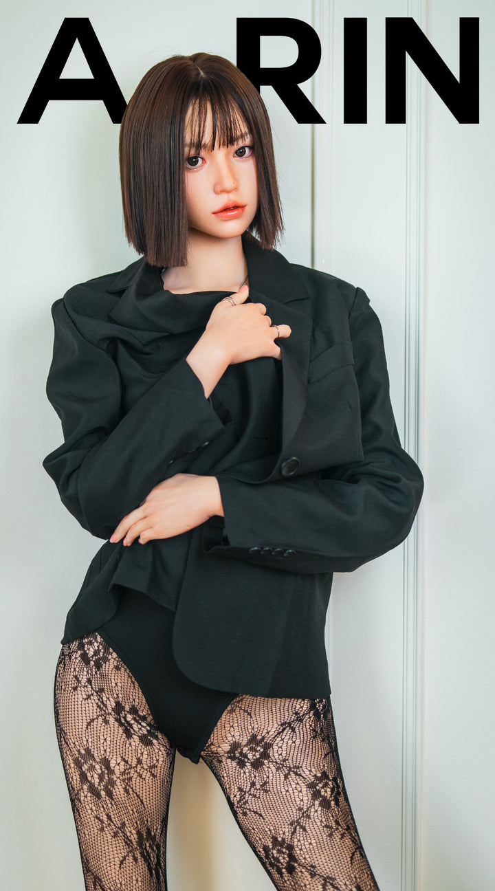 Zelex Doll K-Series 168 cm B Silicone - Arin full body front view in black oversized blazer and lace patterned stockings, short dark bob hair, white studio background
