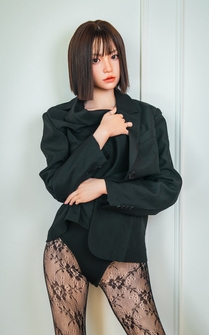 Zelex Doll K-Series 168 cm B Silicone - Arin upper body side view in black oversized blazer, short dark bob hair, white studio background
