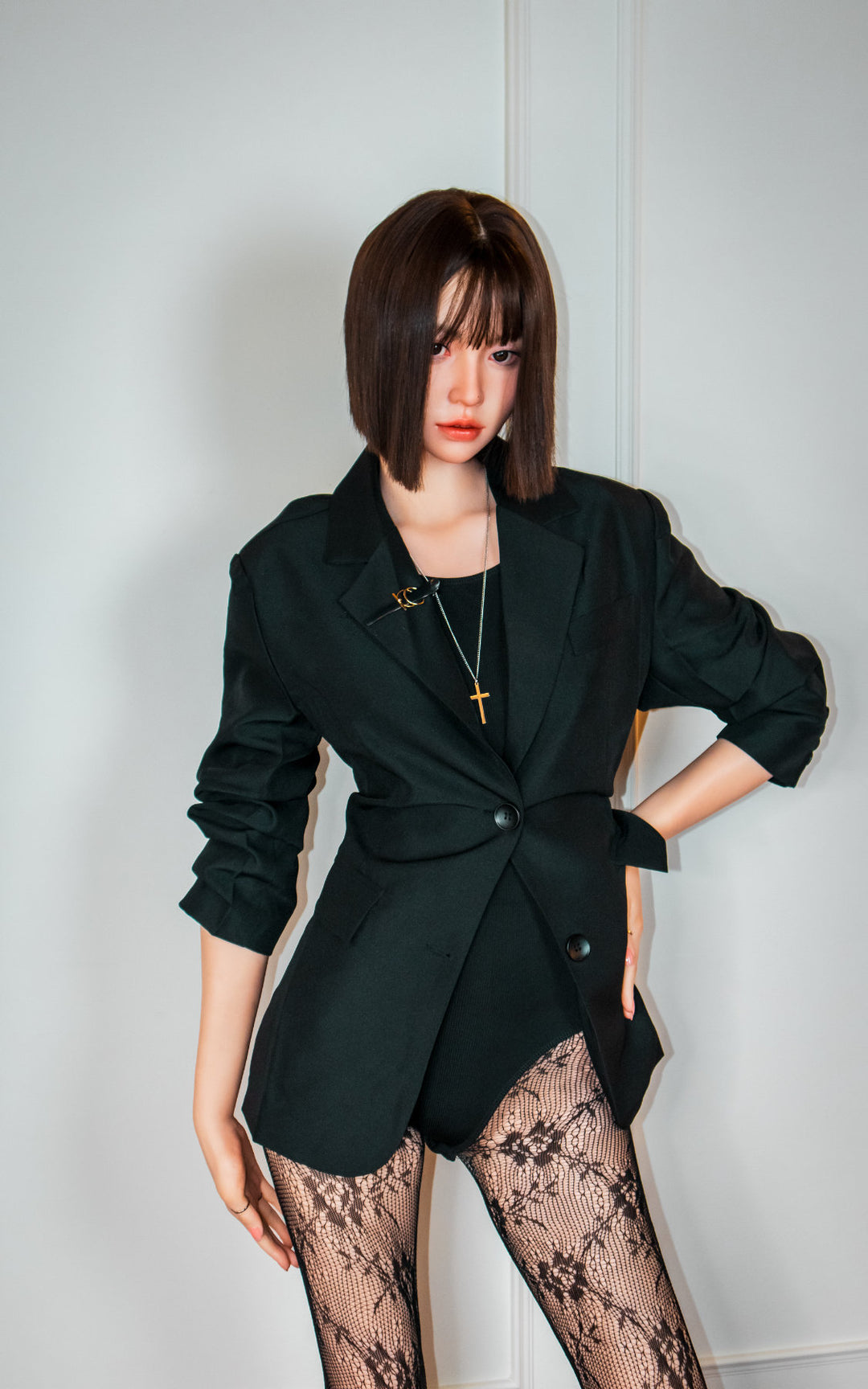 Zelex Doll K-Series 168 cm B Silicone - Arin full body standing pose in black oversized blazer and lace patterned stockings, short dark bob hair, white studio background
