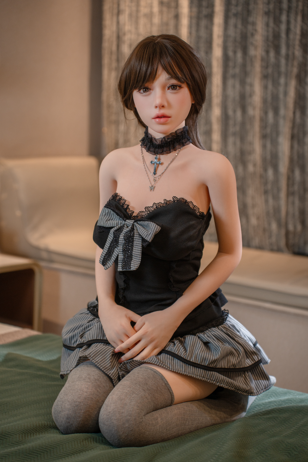 TAYU Nova Series 148 cm D-Cup Hybrid Doll – Katniss V2 in black lace outfit, seated on bed.