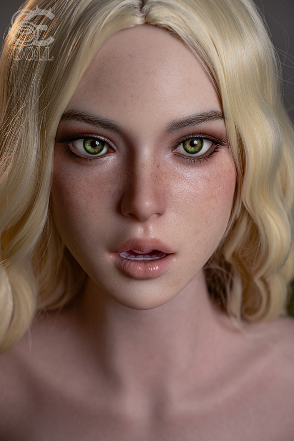 Ultra-realistic close-up of the SEDOLL T103 cm Sophia Lane silicone head featuring blonde hair, green eyes, and detailed facial freckles.